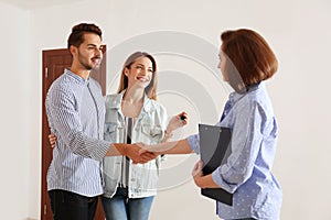Real estate agent with young couple