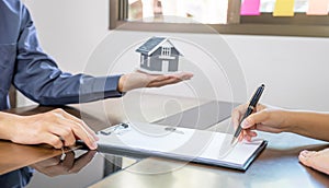 Real estate agents and buyers discuss signing a business contract, renting, buying, mortgage, loan or home insurance