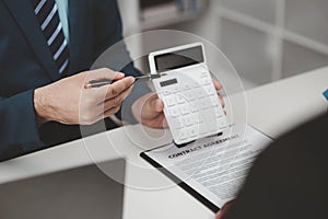 Real estate agents explain models of housing estates in projects to elaborate to clients, explaining and presenting information