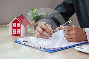 Real Estate Agents Making Buying Contracts - Renting Houses, Businessmen, Home Insurance, Real Estate Business Concepts, Mortgages