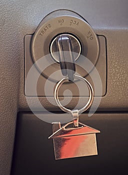 Real estate concept. Car key in ignition photo
