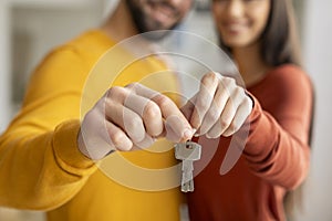 Real Estate Concept. Closeup Shot Of Young Couple Holding Home Keys