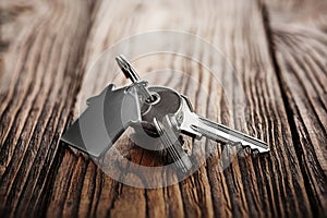 Real estate concept, Key ring and keys on wooden background