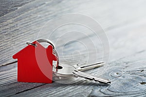 Real estate concept, Key ring and keys on wooden background