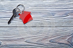 Real estate concept, Key ring and keys on wooden background