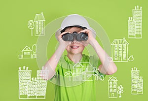 Real estate construction engineering concept. Cute boy with binoculars on green background looking for future home.