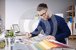 Real Estate Designer Working On Computer