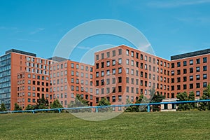 Real estate exterior, modern building facade and blue sky