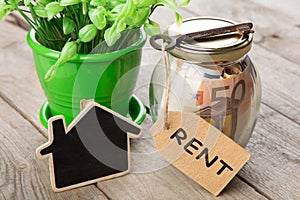 Real estate finance concept - money glass with Rent word