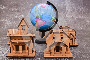 Real estate house model with earth globe