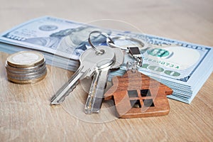 Real estate investing concept. American dollar, cash. Keys close-up