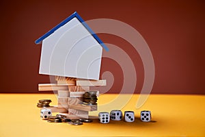 Real estate investment, success and risks at buying immovable property. House mockup with copy space, coins, game dice