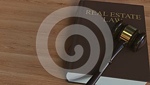 REAL ESTATE LAW book and judge gavel. 3D animation