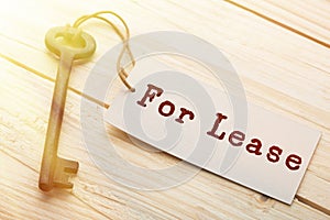 real estate lease concept - old key with tag