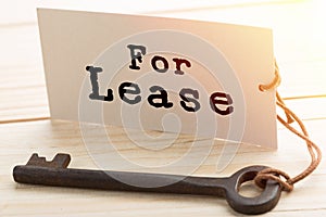 real estate lease concept - old key with tag