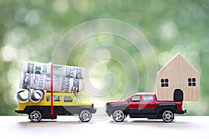 Real estate,Model house and usd dollar money on miniature car on nature green background, Saving money for car, Finance and car