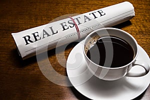 Real estate newspaper, cup of coffee