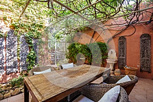 Real estate photography villa, terrasse with table, chairs and plants photo