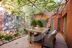 Real estate photography villa, terrasse with table, chairs and plants photo