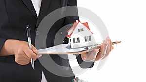 Real estate practitioners holding documents and small house models in hand