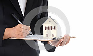 Real estate practitioners holding documents and small house models in hand