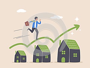 Real estate or property growth concept. Housing price rising up, businessman running on rising green graph on house roof