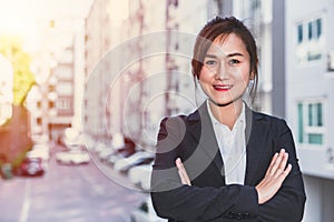 Real estate sale agency woman  portrait with condominium accommodation blur background for home asset business advertising