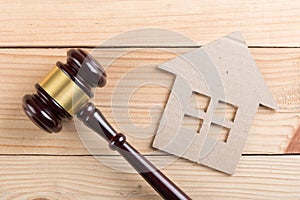 Real estate sale auction concept - gavel and house model