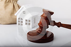 Real estate sale auction concept. Gavel and house model