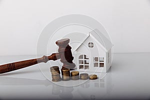 Real estate sale auction concept. Wooden gavel and house model