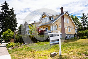 Real Estate Sale Sign along a Street