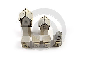 .Real Estate Sale Small Toy Wooden Houses and Sale Lettering
