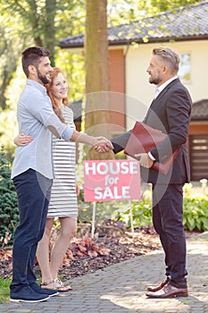 Real estate seller thanking couple