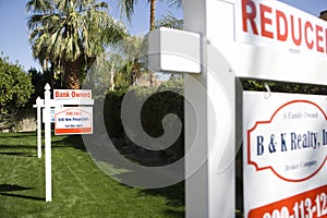 Real Estate Signs at Foreclosed Property
