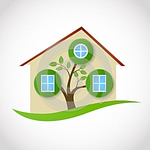 Real estate symbol of ecological house with tree and leaves