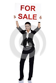 Real estate woman holding for sale sign