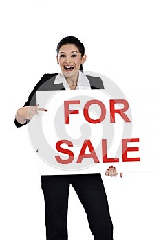 Real estate woman holding for sale sign