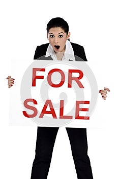 Real estate woman holding for sale sign