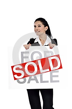 Real estate woman holding for sale - sold sign