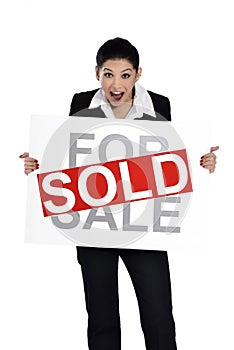 Real estate woman holding for sale - sold sign