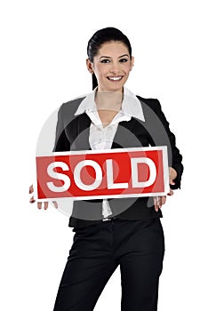 Real estate woman holding a sold sign
