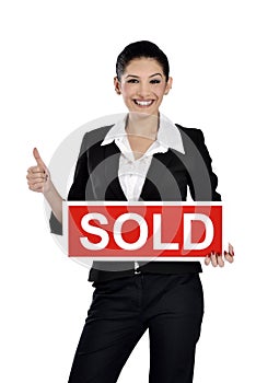 Real estate woman holding a sold sign