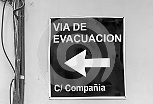 Real evacuation sign in spanish photo