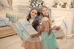 Real feelings. delivery christmas gifts. happy little girls sisters celebrate winter holiday. christmas time. happy new