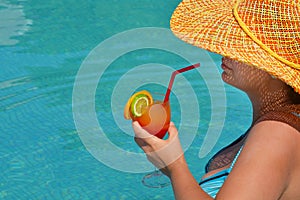 Real female beauty relaxing in swimming pool