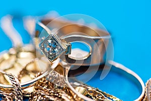 Real gold rings with diamonds, gems close up macro shot