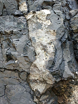 Real Grunge Rock Stone Texture. A real natural stone texture in pale blue, grey and brown ideal as a background, layer.