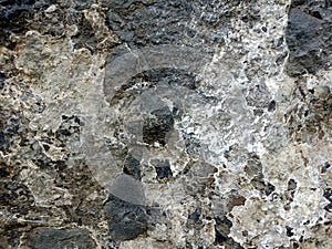 Real Grunge Rock Stone Texture. A real natural stone texture in pale blue, grey and brown ideal as a background, layer.