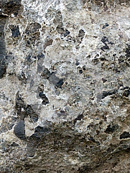 Real Grunge Rock Stone Texture. A real natural stone texture in pale blue, grey and brown ideal as a background, layer.