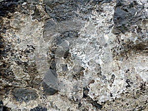 Real Grunge Rock Stone Texture. A real natural stone texture in pale blue, grey and brown ideal as a background, layer.